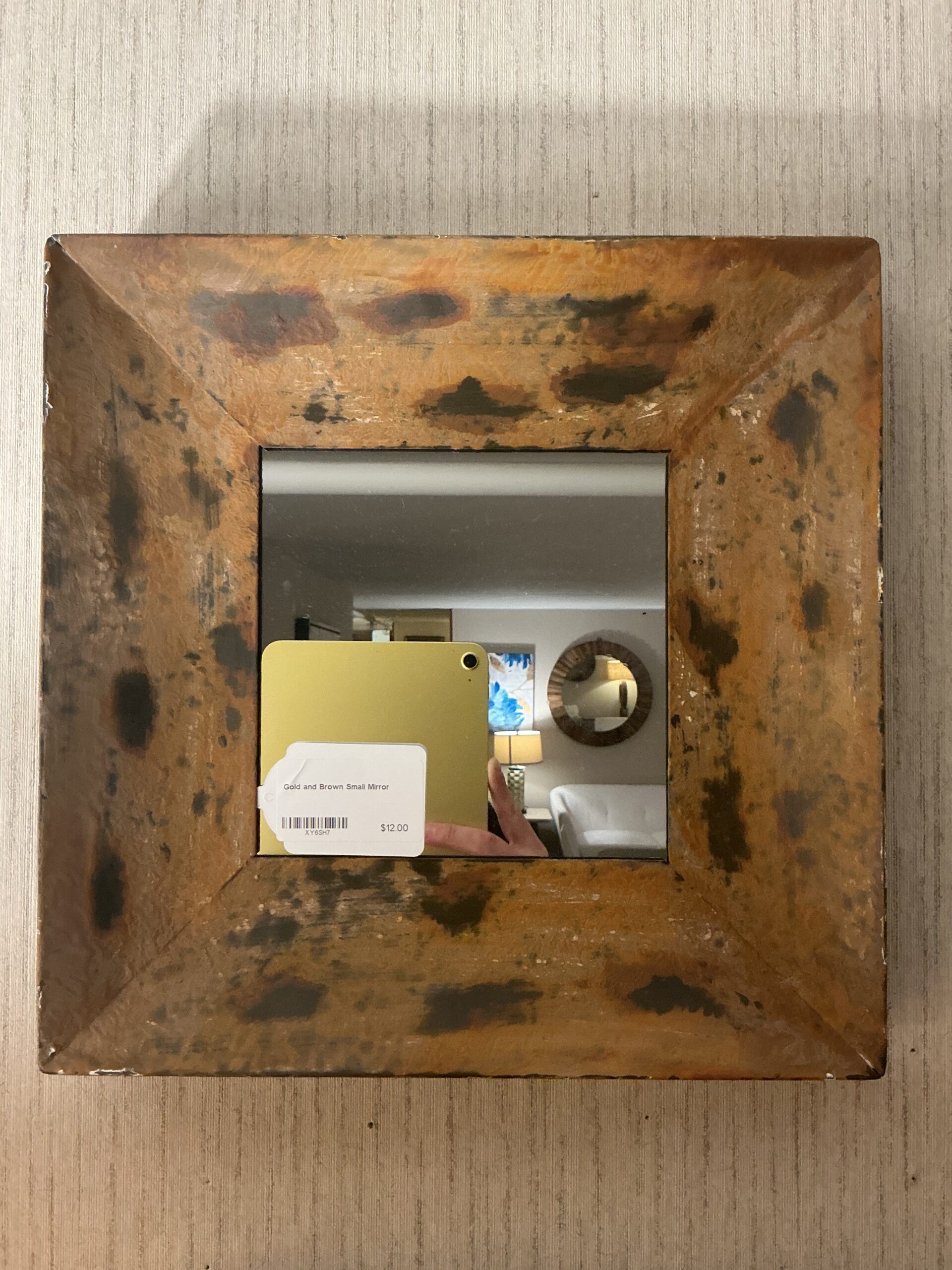 gold and brown small mirror