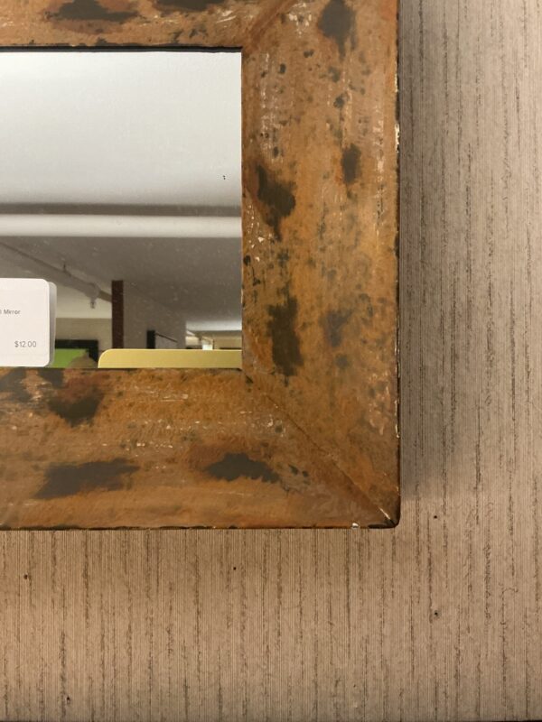 gold and brown small mirror