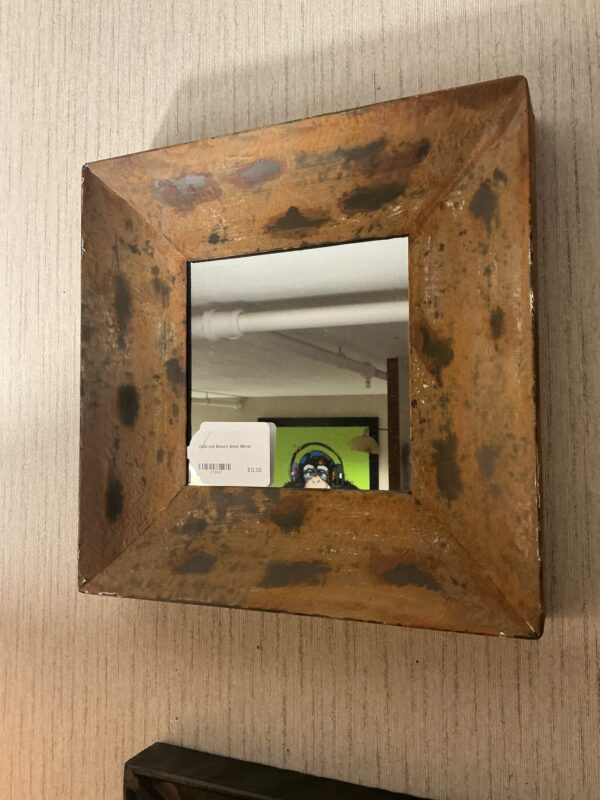 gold and brown small mirror
