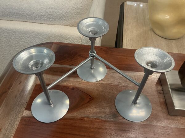 three candle stick holder