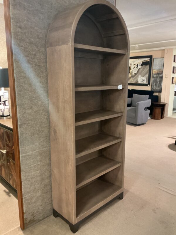 tall wooden arch bookcase