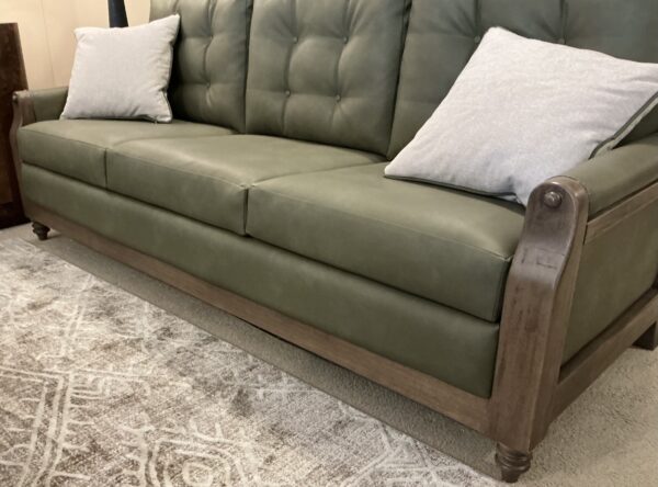 olive green wooden framed sofa