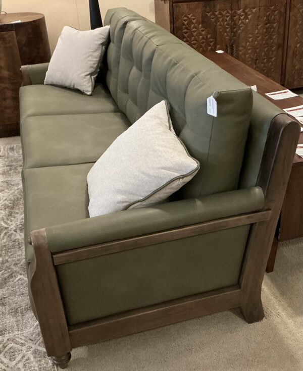 olive green wooden framed sofa