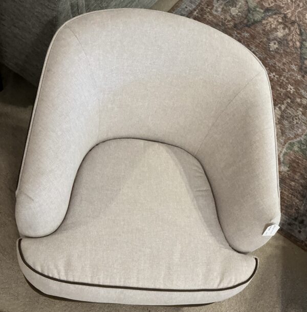 brown and sand swivel chair