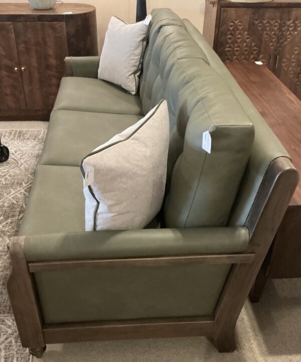 olive green wooden framed sofa