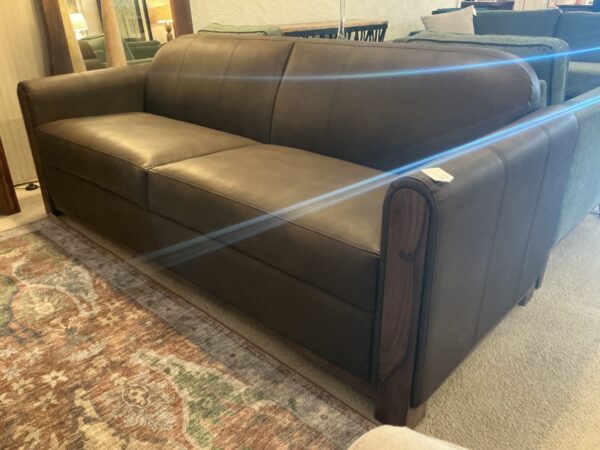 tan wooden framed sofa
