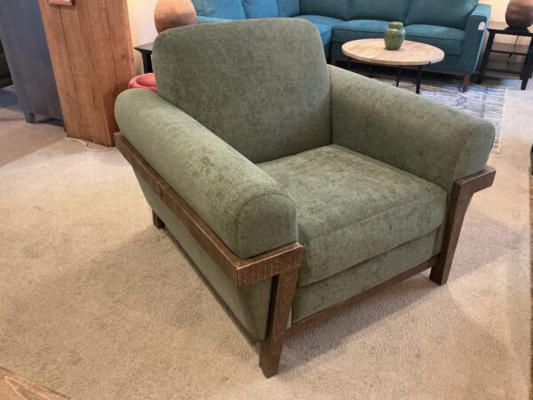wooden framed green armchair