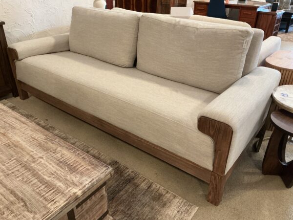 light colored wooden framed base sofa